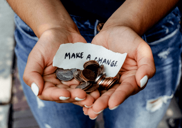 two hands with coins and a note that says "Make a Chane"