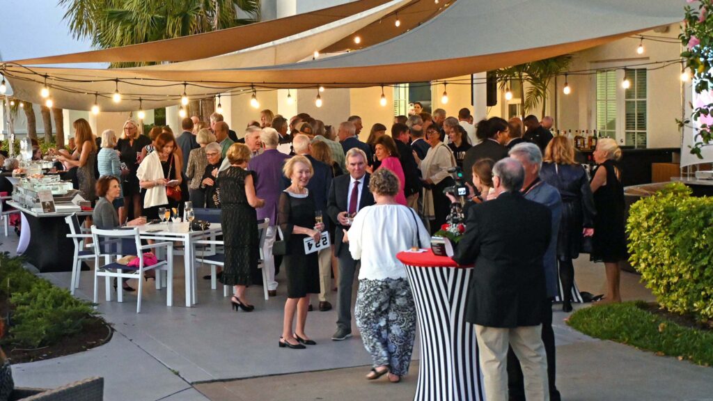 Annual Gala & Auction attendees mingling on the patio