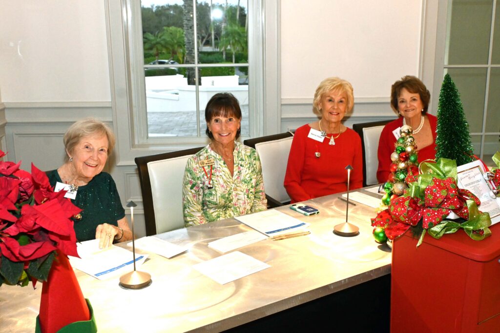 Grand Harbor Community Outreach volunteers at the Evening of GIving registration table