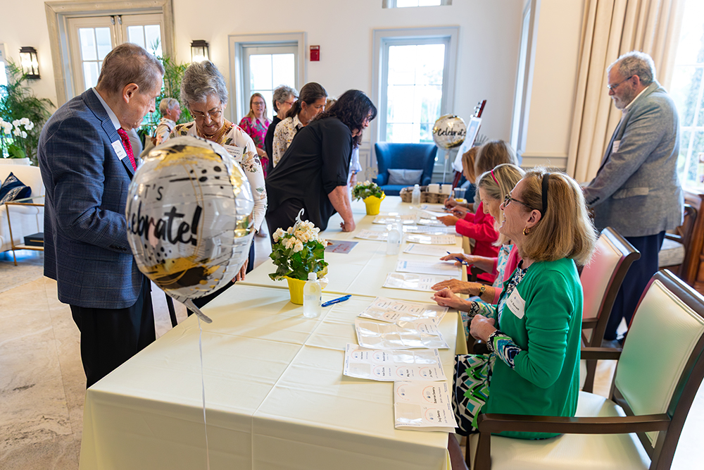 Grand Harbor Community Outreach volunteers at the Annual Gala registration table
